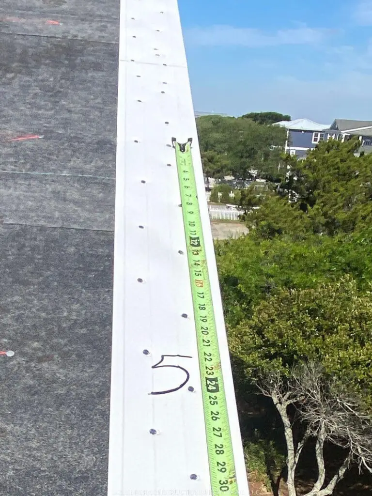 New roof drip edge installation on coastal home in Oak Island NC by RGR Construction and Roofing during roof replacement project with fortified roofing components.