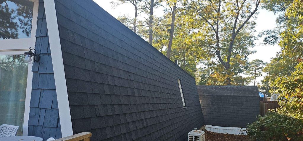 Oak Island Mansard Roof Fortification with CertainTeed Landmark Moire Black — project photograph
