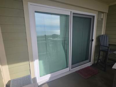 Hurricane Grad DP 5 Sliding Glass Door in Oak Island NC on Oceanfront Condo by RGR Construction and Roofing, LLC