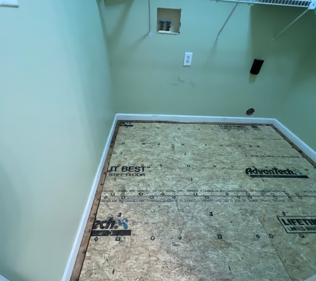 Caving Floor Flooring Installation in Oak Island, NC by RGR Construction and Roofing, LLC