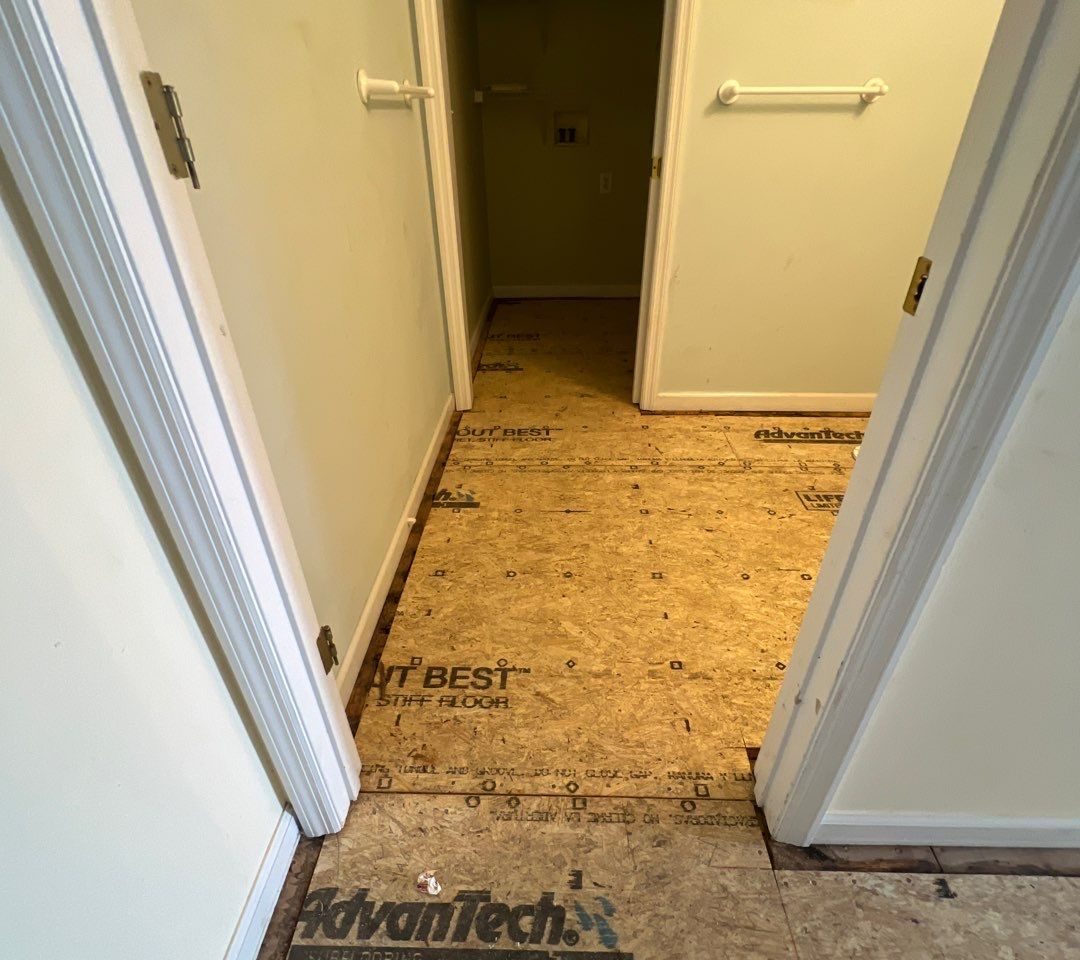 Caving Floor Flooring Installation in Oak Island, NC by RGR Construction and Roofing, LLC