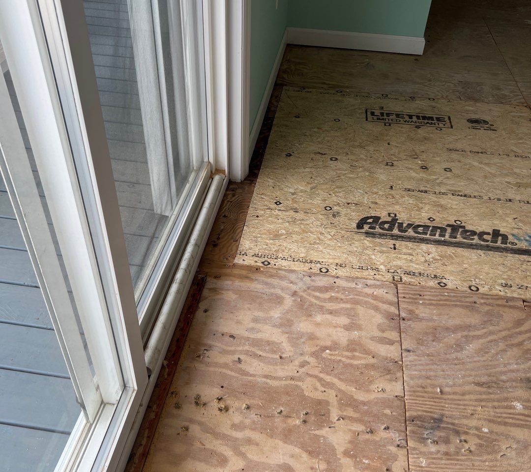 Caving Floor Flooring Installation in Oak Island, NC by RGR Construction and Roofing, LLC