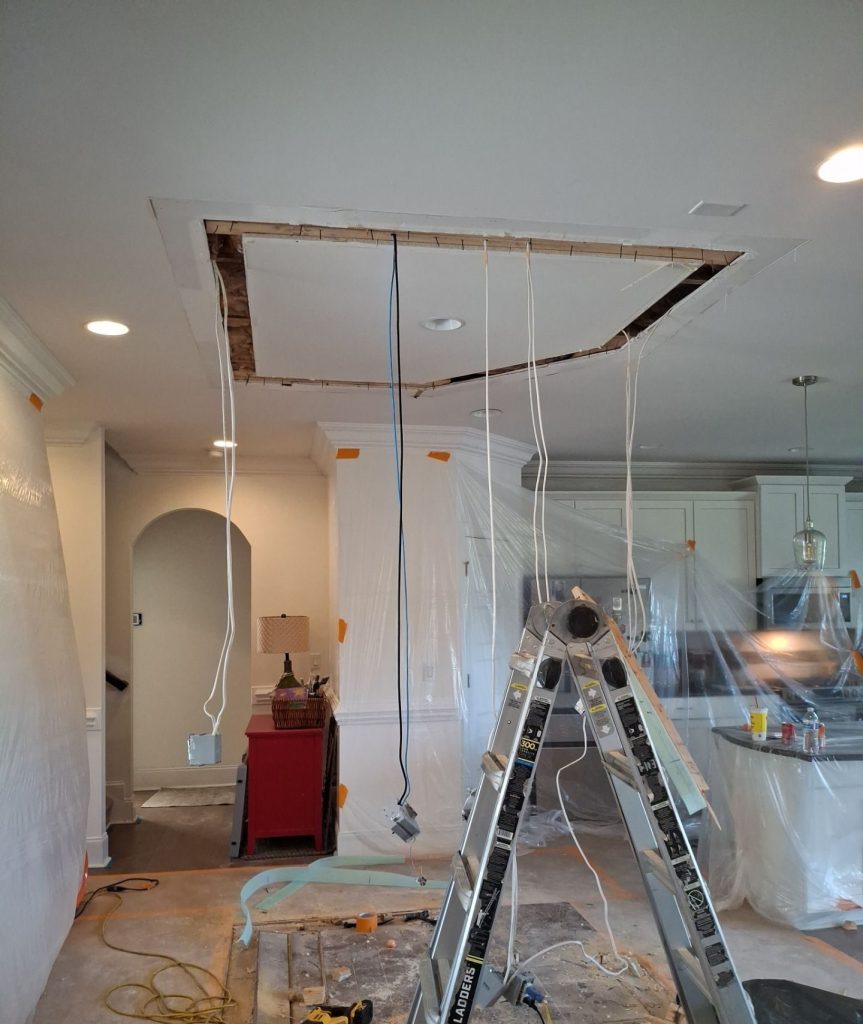 Opened ceiling and protected work area during RGR’s Hampstead interior renovation