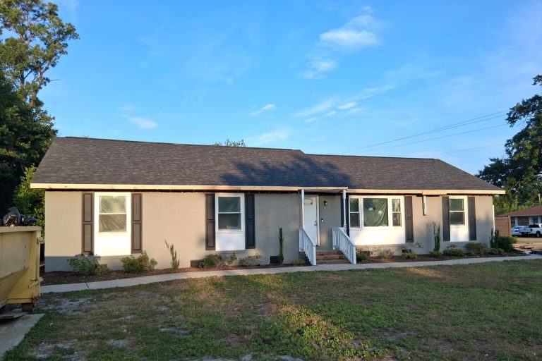 New shingle roof above the front of the Wilmington home while interior restoration continues