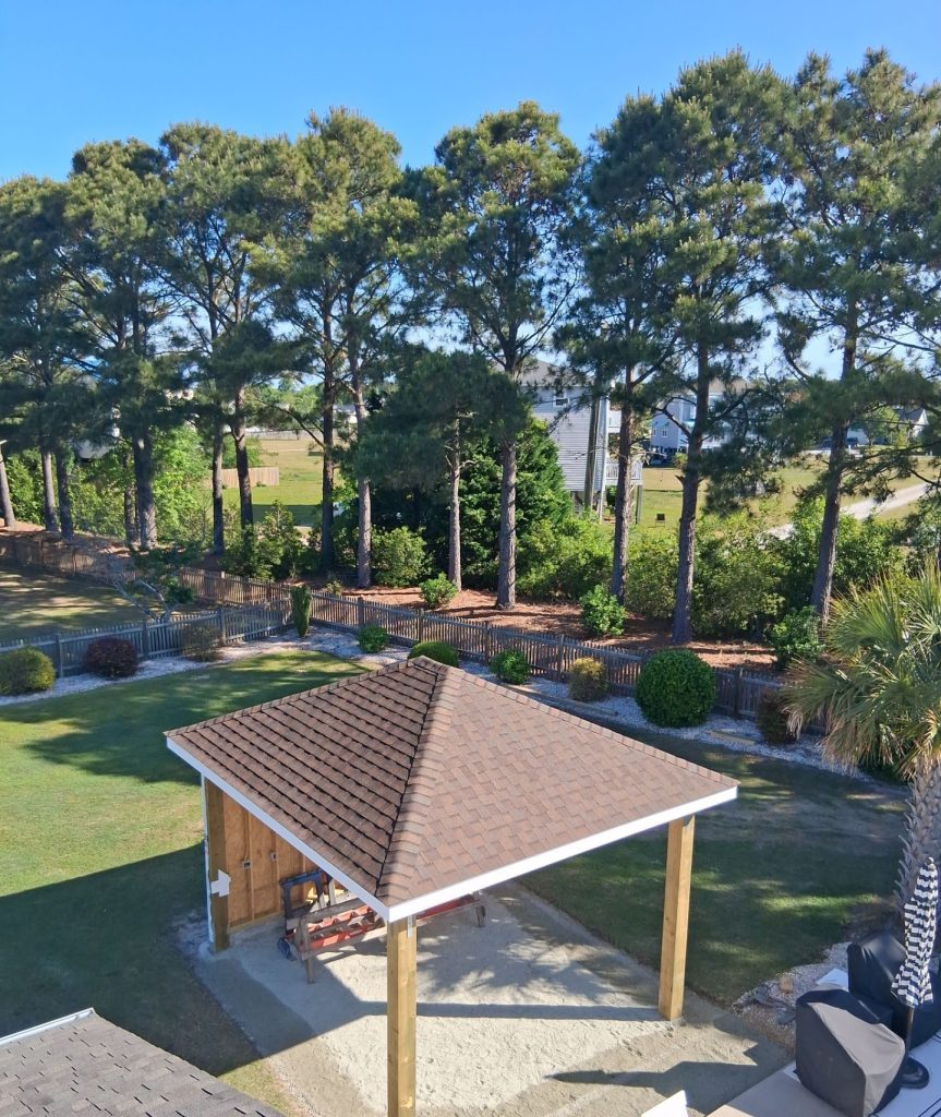 Elevated view of a poolside gazebo with Heather Blend shingles and white roof-edge trim in Hampstead