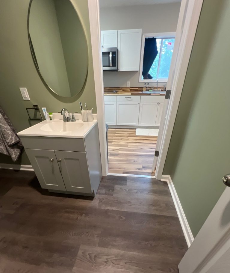 Flooring connection between the bathroom and kitchen at the Belville home