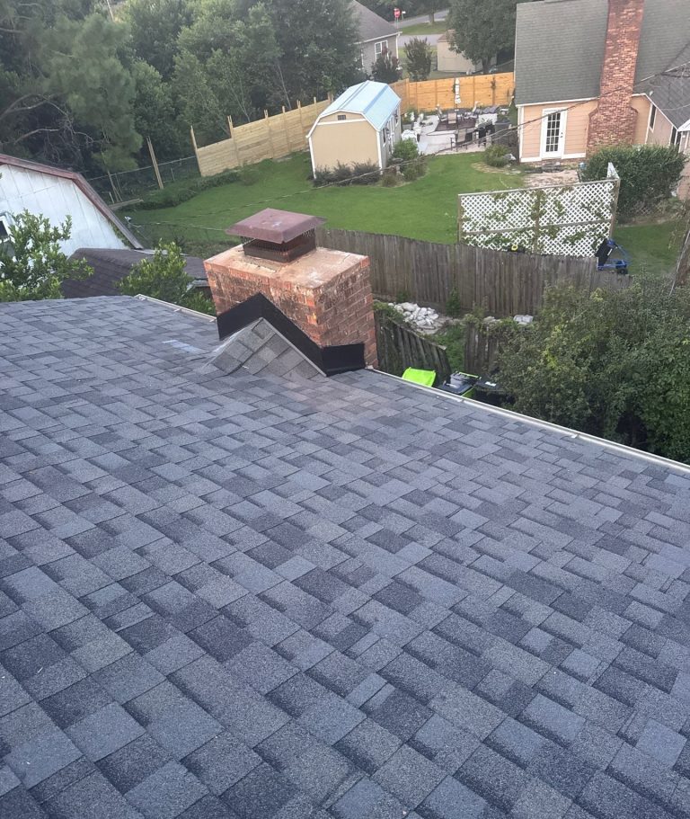 Brick chimney and adjoining shingle roof after the Wilmington repair