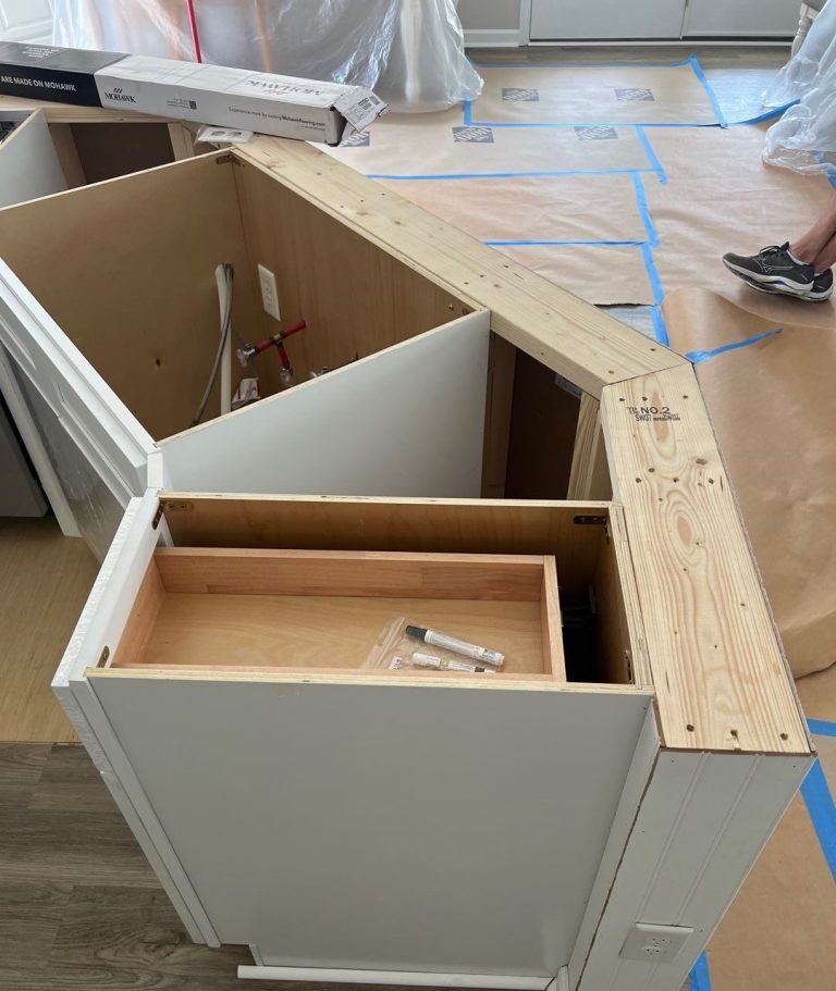 Kitchen island cabinet opened during Carolina Beach interior repairs