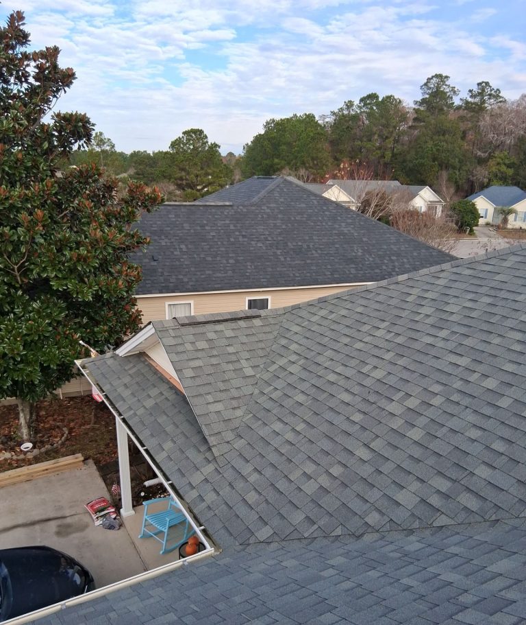 Elevated view across the existing shingle roof and adjoining roof planes in Leland