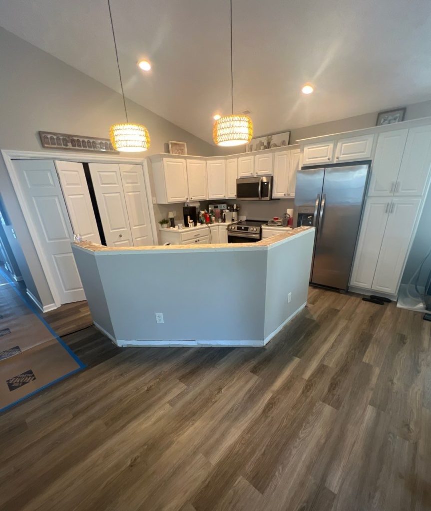 Reassembled kitchen island and flooring after interior repairs in Carolina Beach