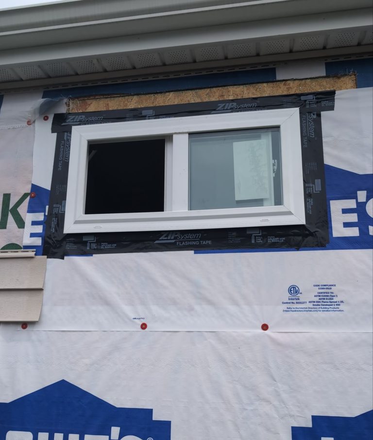 Flashing tape around the new sliding window opening in Wilmington