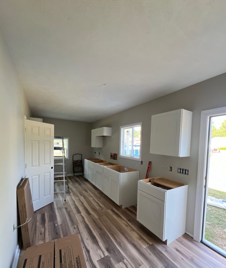 Kitchen cabinet boxes before countertops during the Belville remodel