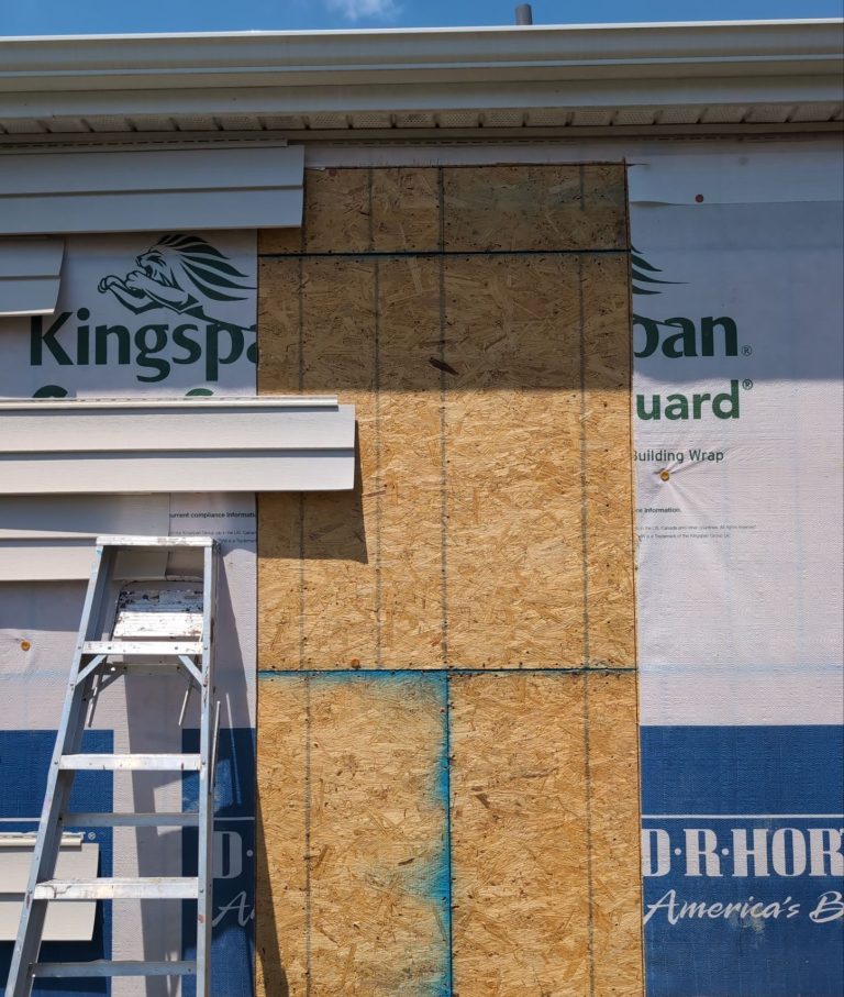 Sheathing and upper opening during the Wilmington window installation