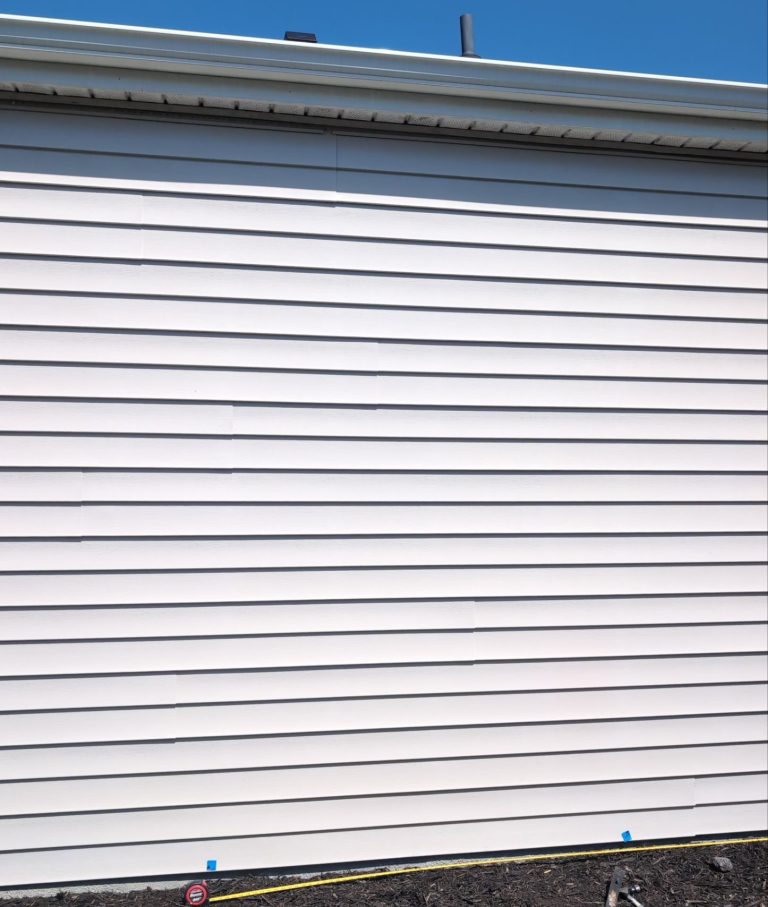 Original lap siding before the new bathroom window opening