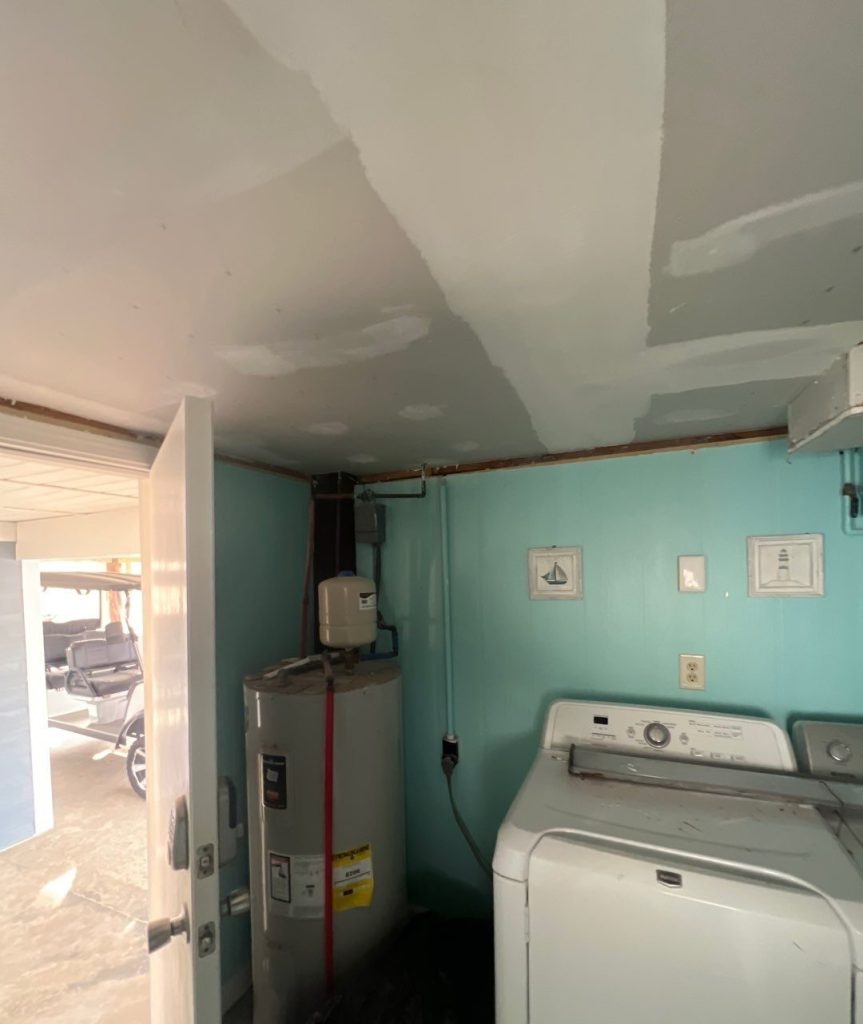 Ceiling drywall repair in progress in Oak Island, NC