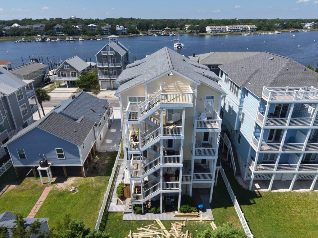 Aerial view of exterior decks and stairways during repair work at a coastal home in Carolina Beach, North Carolina.