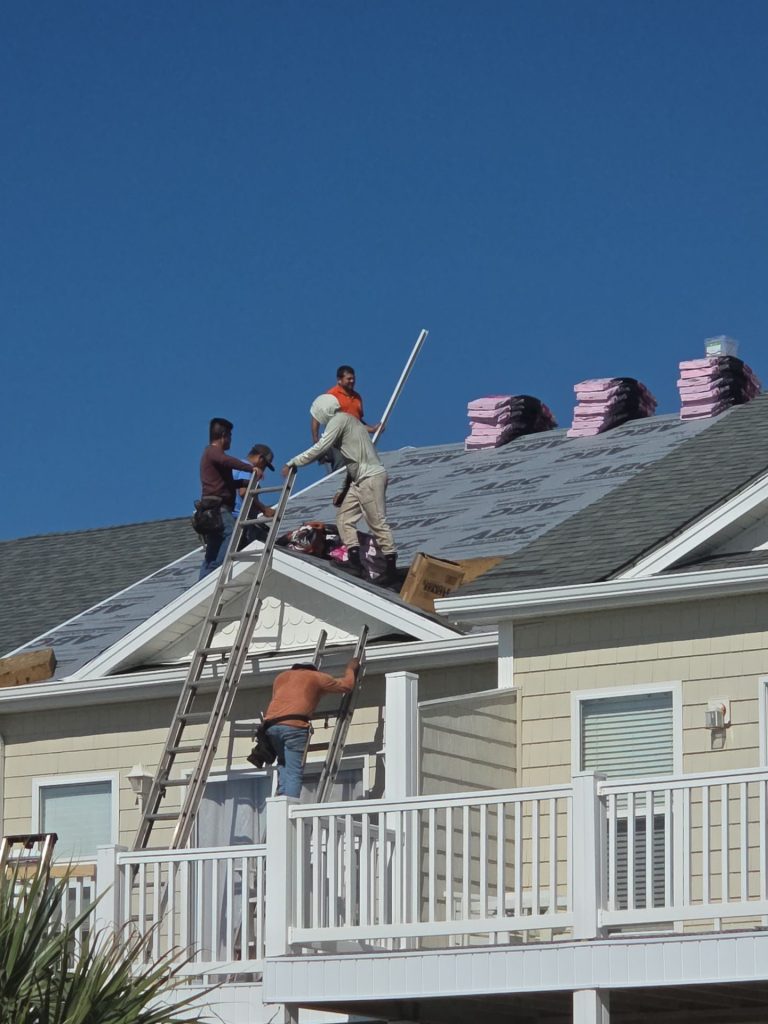 RGR crew installing a shingle roof in Surf City, NC — work in progress