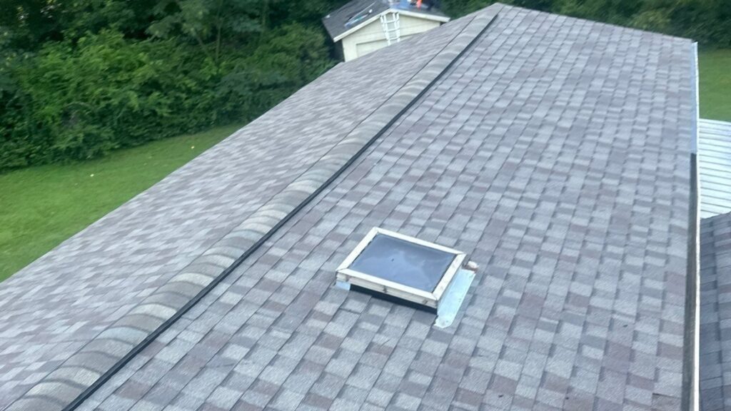 Gray shingle roof and skylight at an RGR roofing project in Wilmington
