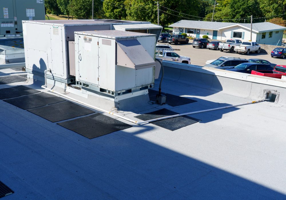 Commercial hotel roof installation in Southport NC completed by RGR Construction & Roofing on a hospitality property